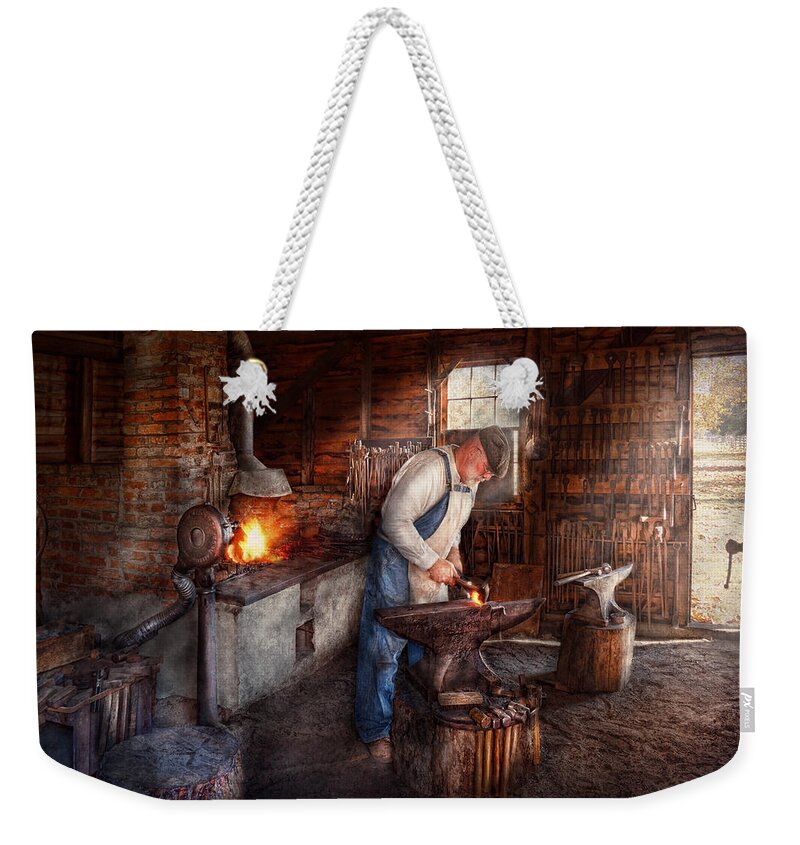 Blacksmith Weekender Tote Bag featuring the photograph Blacksmith - The Smith by Mike Savad