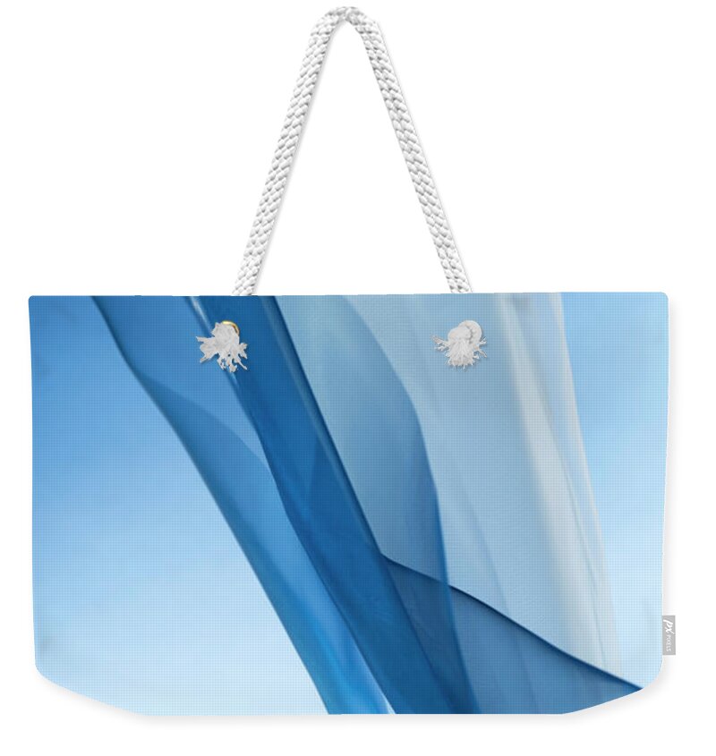 Color Image Weekender Tote Bag featuring the photograph Blue And White Silk On A Bright by Gm Stock Films