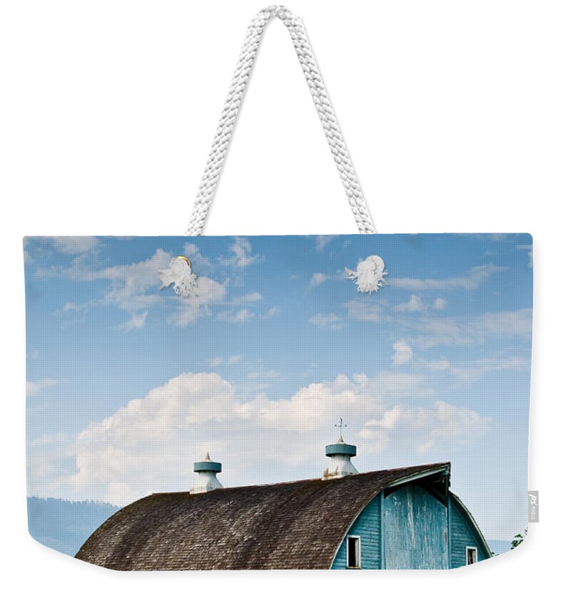Agricultural Activity Weekender Tote Bag featuring the photograph Blue Barn in the Stillaguamish Valley by Jeff Goulden