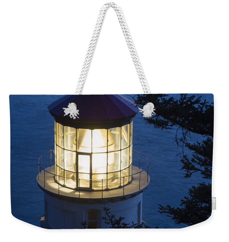 Oregon Weekender Tote Bag featuring the photograph Blue Lighthouse by Brian Jannsen