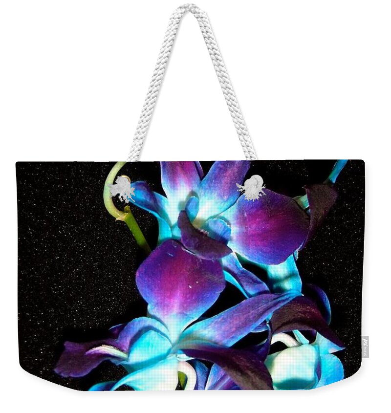 Flowers Weekender Tote Bag featuring the photograph Blue Orchids by Stephanie Moore