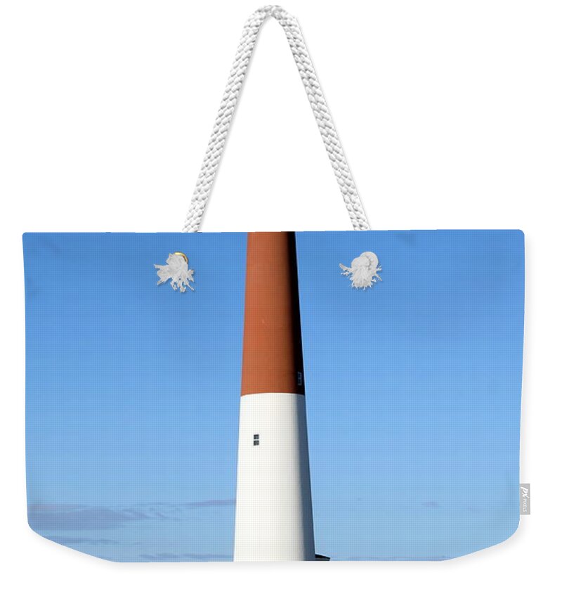Barnegat Lighthouse Weekender Tote Bag featuring the photograph Blue Sky Blue Sea And Barnegat Light by Christiane Schulze Art And Photography