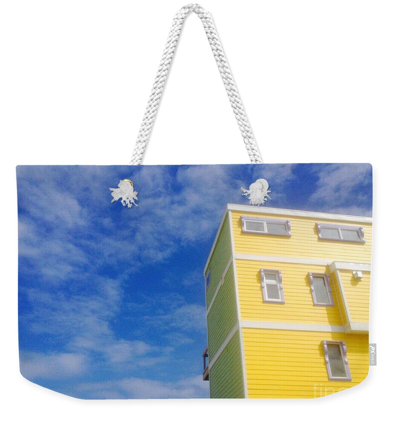 Yellow Weekender Tote Bag featuring the photograph Blue sky Yellow house by WaLdEmAr BoRrErO