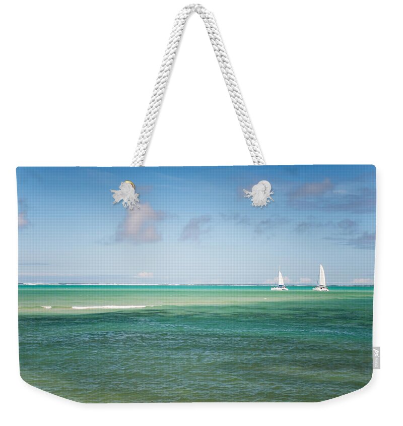 Ocean Weekender Tote Bag featuring the photograph Blues. Mauritius by Jenny Rainbow