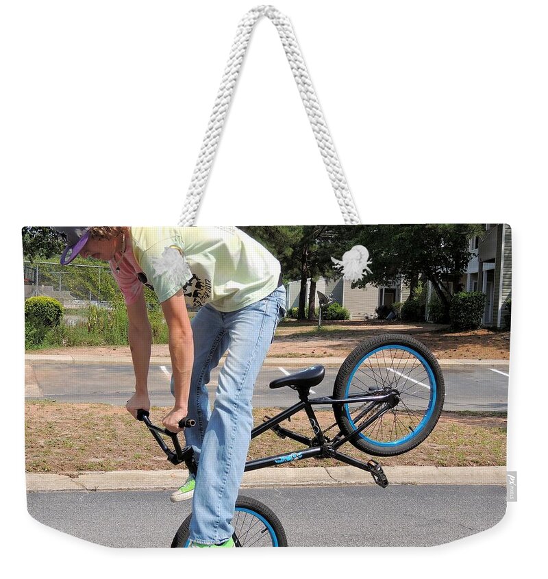 Bmx Weekender Tote Bag featuring the photograph Bmx rider by Aaron Martens