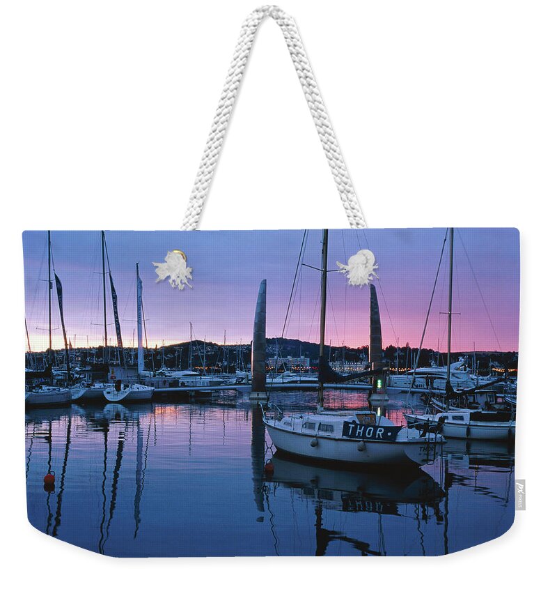 England Weekender Tote Bag featuring the photograph Boats Moored In Harbour At Sunset by David C Tomlinson