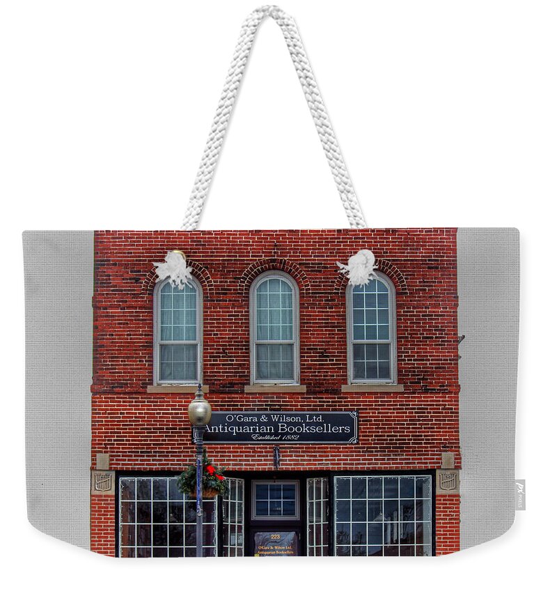 Bookseller Weekender Tote Bag featuring the photograph Bookseller by Jackson Pearson