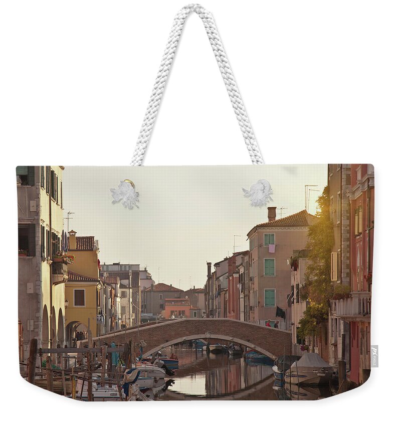 Built Structure Weekender Tote Bag featuring the photograph Bridge Over Urban Canal by Walter Zerla