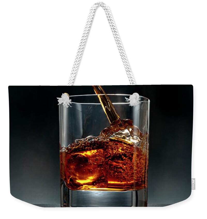 Alcohol Weekender Tote Bag featuring the photograph Brown Liquor Drink Pour On Black by Chris Stein