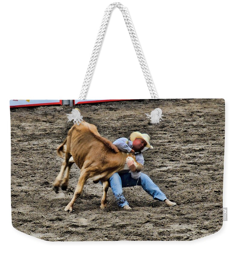 Rodeo Weekender Tote Bag featuring the photograph Bull Dogging by Ron Roberts