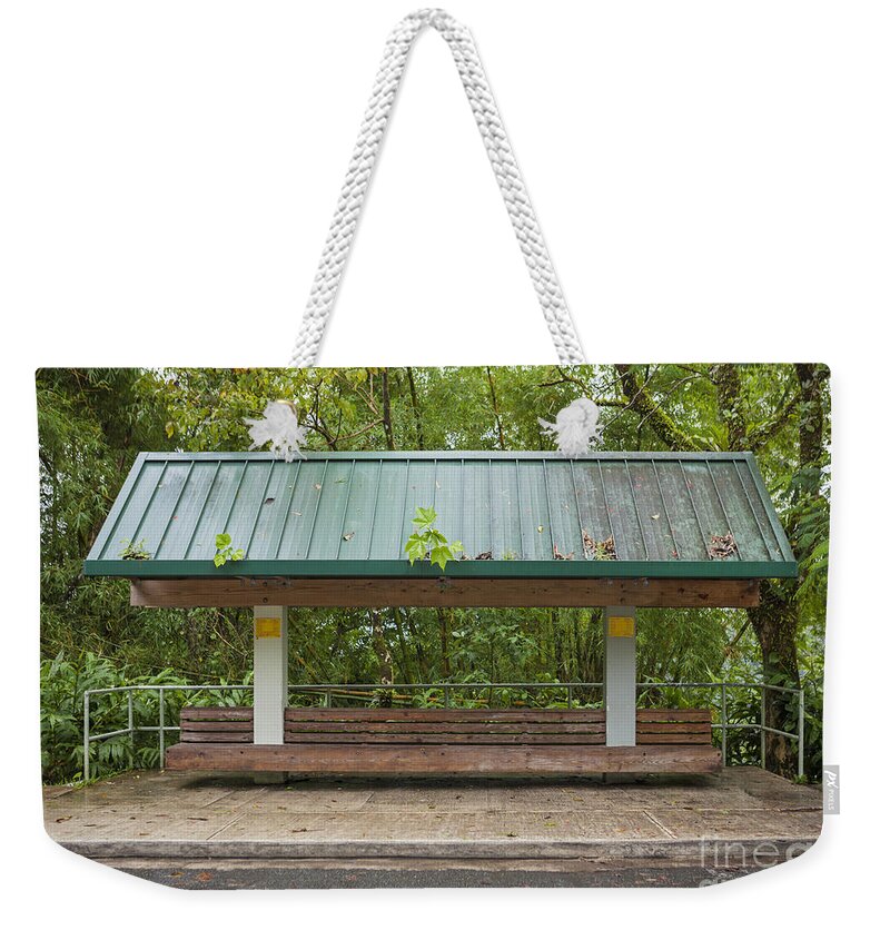 El Yunque Weekender Tote Bag featuring the photograph Bus Stop Bench In The Rainforest by Bryan Mullennix