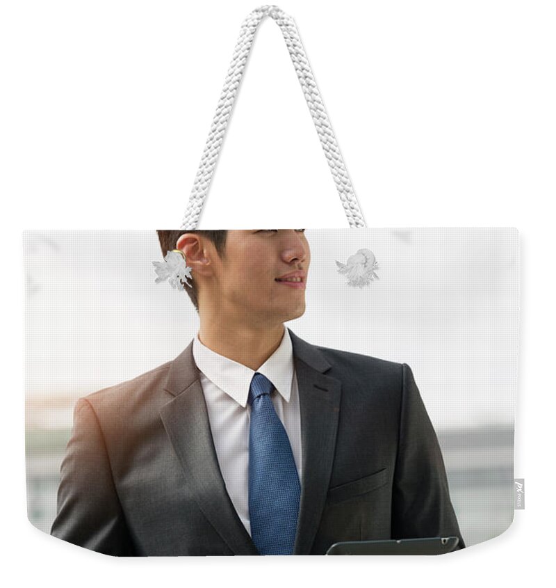 Young Men Weekender Tote Bag featuring the photograph Businessman Holding Digital Tablet by Eternity In An Instant