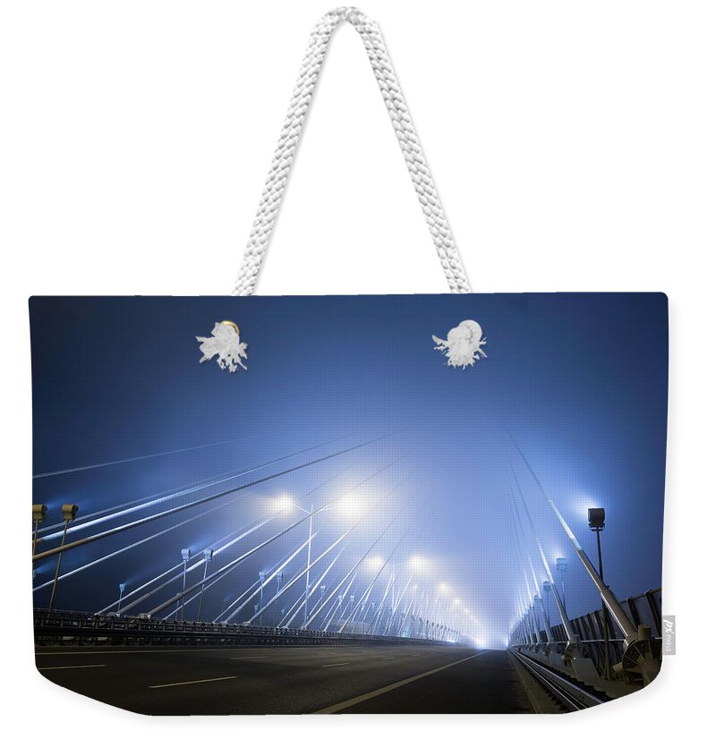 Pole Weekender Tote Bag featuring the photograph Cable-stayed Bridge At Foggy Night by Republica