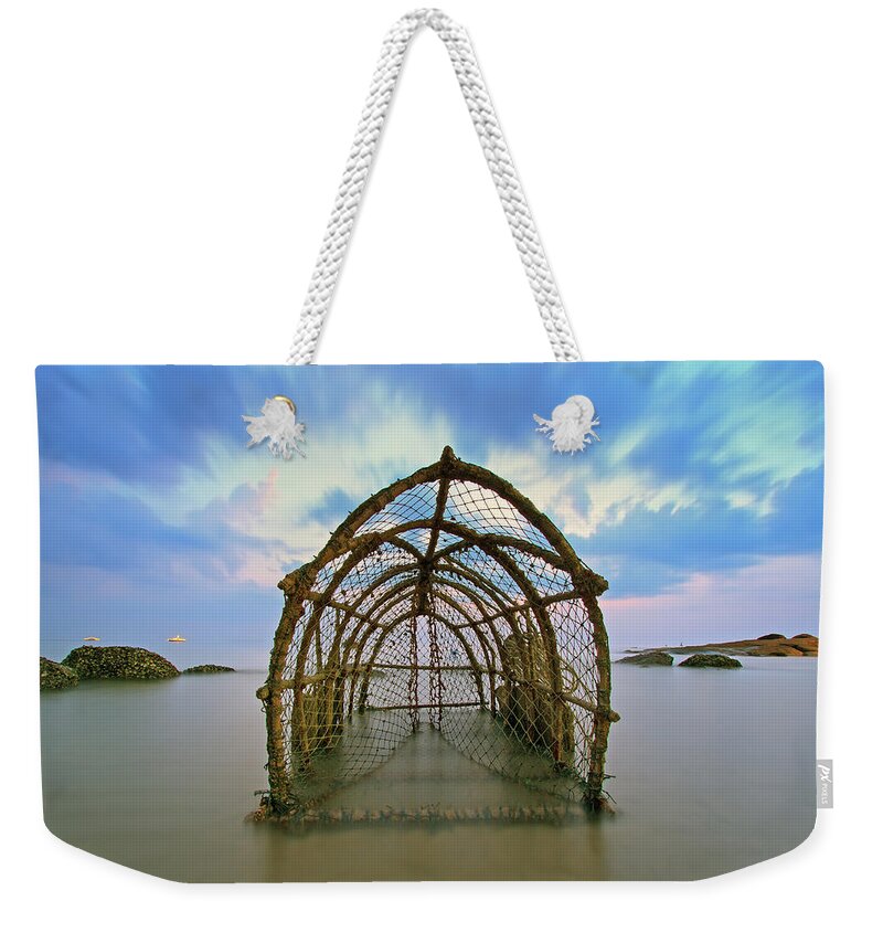 Tranquility Weekender Tote Bag featuring the photograph Cages With Fish Traps by Monthon Wa