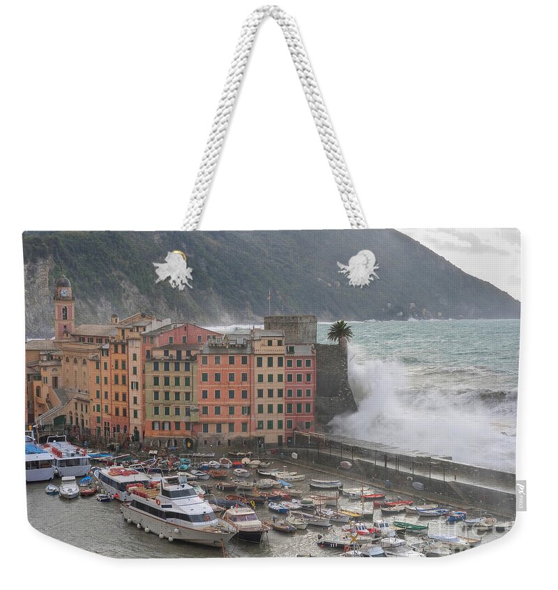 Agitated Weekender Tote Bag featuring the photograph Camogli under a storm by Antonio Scarpi