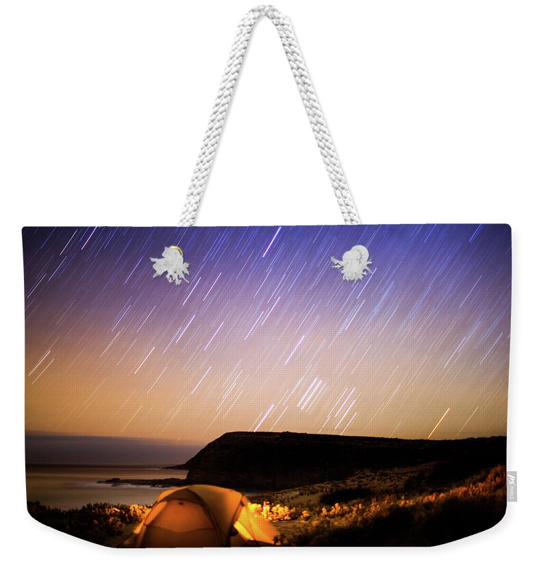 Tranquility Weekender Tote Bag featuring the photograph Camping In Tent Under Star Trails In by Robert Lang Photography