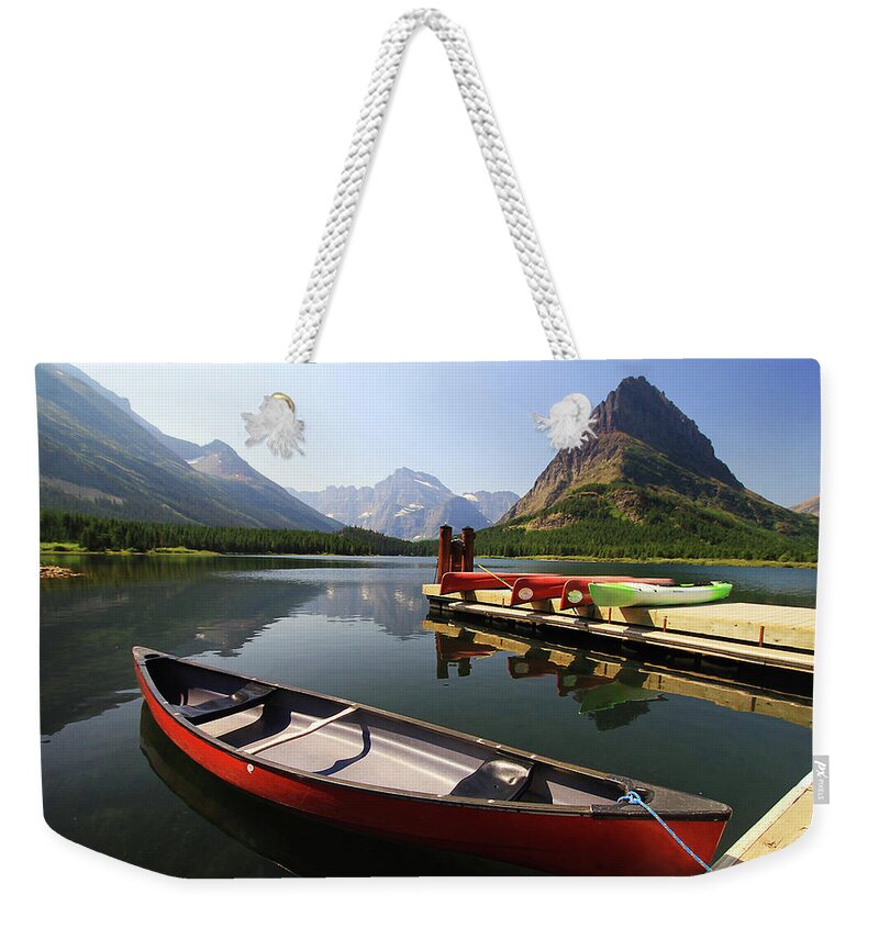 Scenics Weekender Tote Bag featuring the photograph Canoe At St Mary Lake In Glacier by L. Toshio Kishiyama