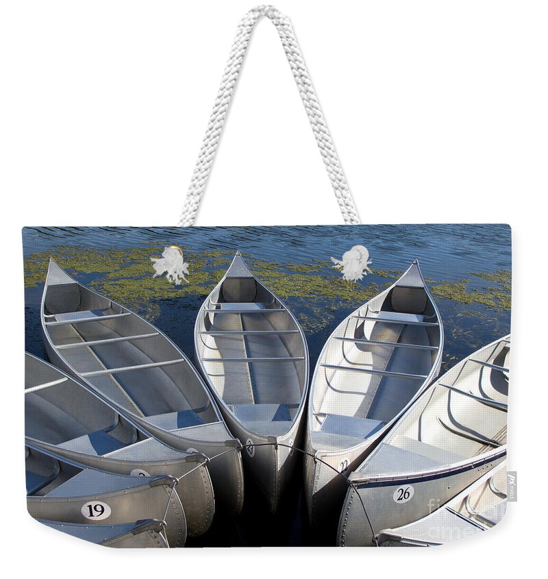Canoes Weekender Tote Bag featuring the photograph Canoes by Ann Horn
