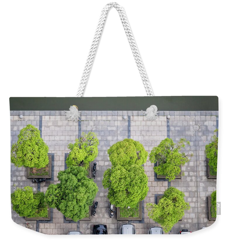In A Row Weekender Tote Bag featuring the photograph Cars On A Parking Lot by Chinaface