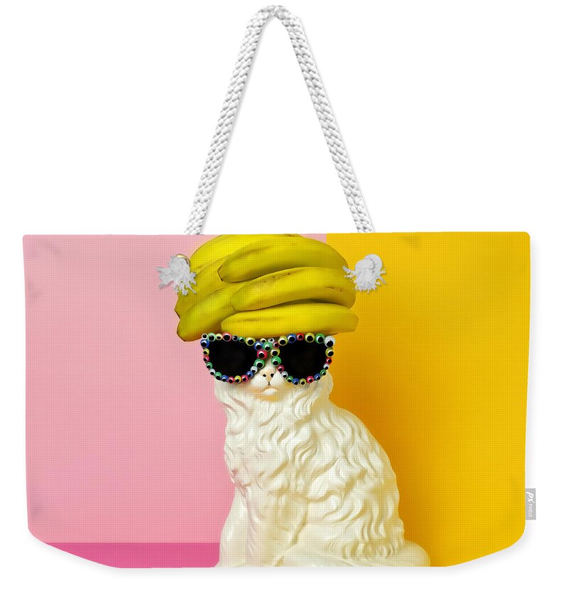 Statue Weekender Tote Bag featuring the photograph Cat Wearing Sunglasses And Banana Wighat by Juj Winn