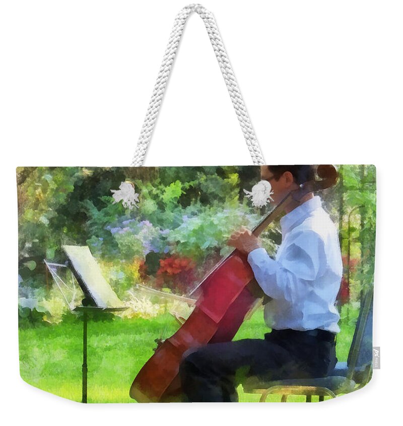Cello Weekender Tote Bag featuring the photograph Cellist in the Garden by Susan Savad