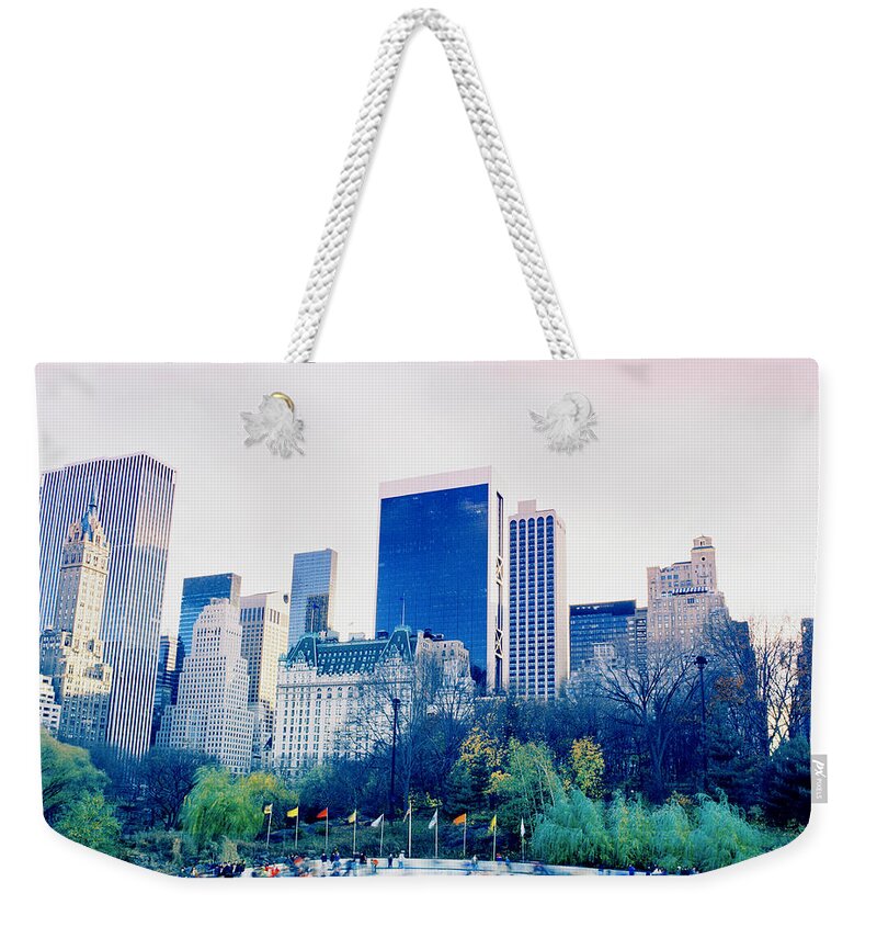 New York Weekender Tote Bag featuring the photograph New York In Motion by Shaun Higson