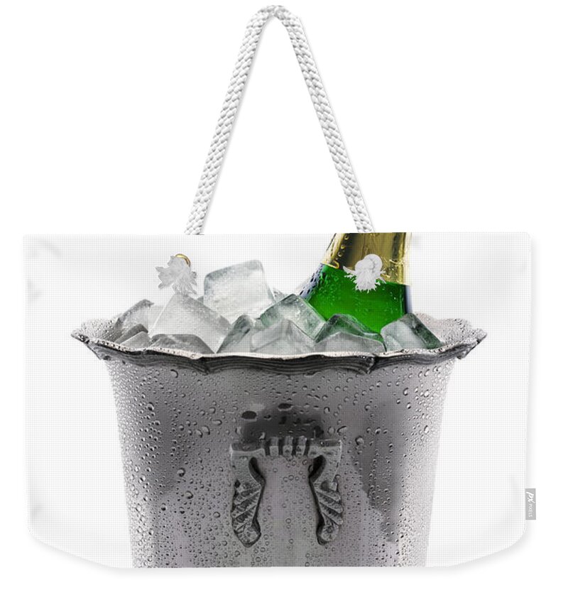 Champagne Weekender Tote Bag featuring the photograph Champagne bottle on ice by Johan Swanepoel