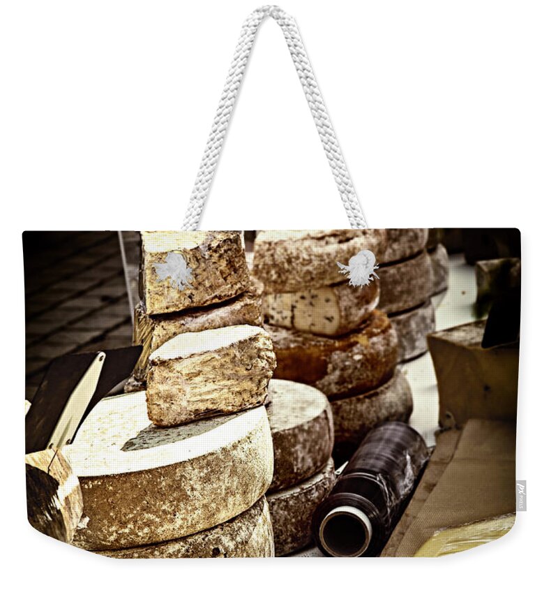 Cheese Weekender Tote Bag featuring the photograph Cheeses on the market in France by Elena Elisseeva