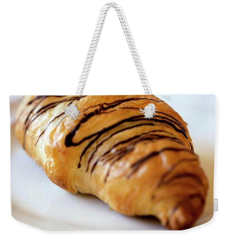 Bavaria Weekender Tote Bag featuring the photograph Chocolate Croissant On White Plate by Lacaosa