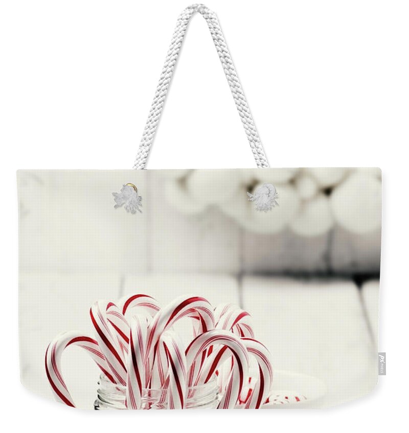 White Background Weekender Tote Bag featuring the photograph Christmas Candy by Claudia Totir