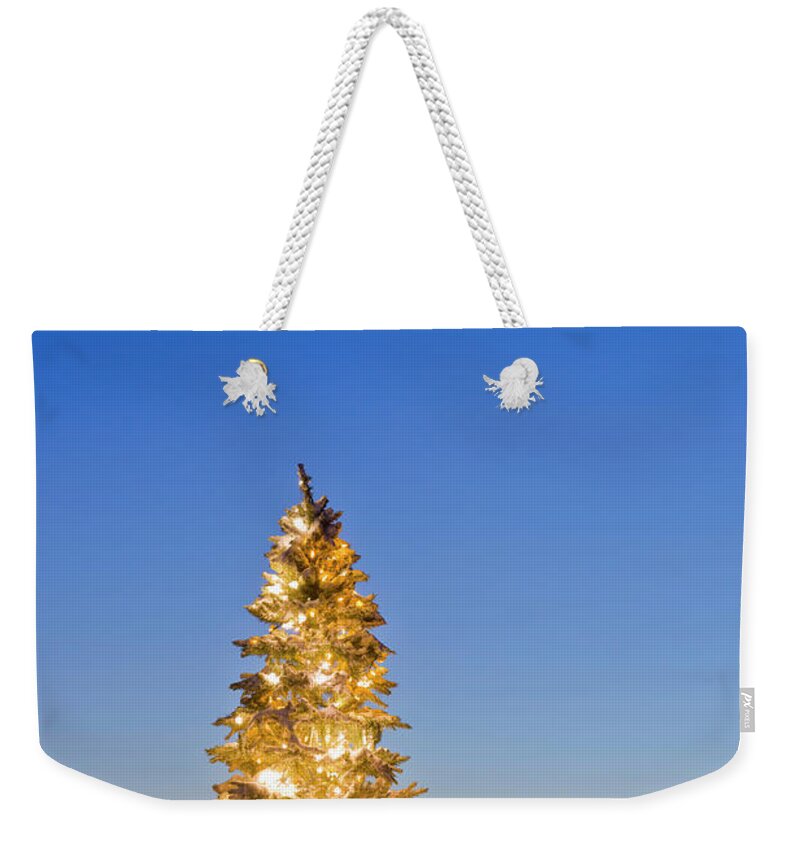 Dawn Weekender Tote Bag featuring the photograph Christmas Tree Decorated And Lit With by Kevin Smith / Design Pics