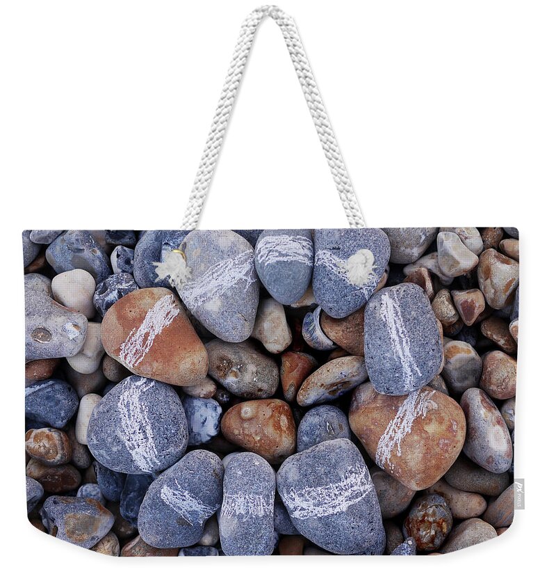 Sussex Weekender Tote Bag featuring the photograph Circle Of Pebbles by Fiona Crawford Watson