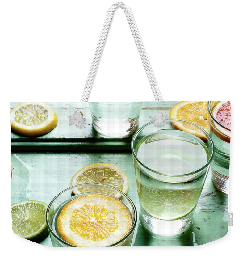 Orange Weekender Tote Bag featuring the photograph Citrus, Glass, Water by Horváth-gallai Beatrix