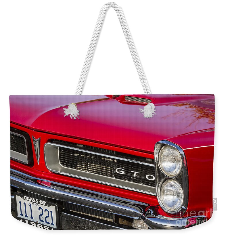1965.pontiac Weekender Tote Bag featuring the photograph Class of 1965 by Dennis Hedberg