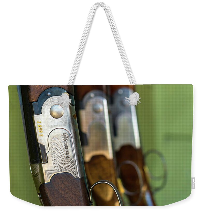 Photography Weekender Tote Bag featuring the photograph Close-up Of Beretta Shotguns by Panoramic Images