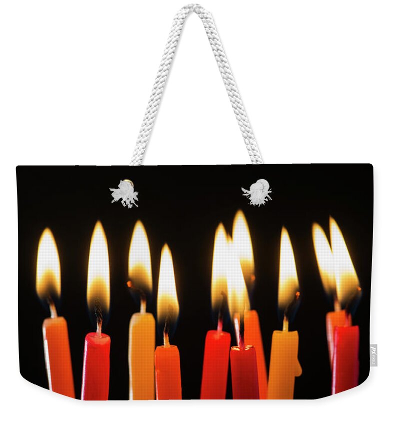 Black Background Weekender Tote Bag featuring the photograph Close-up Of Birthday Candles by Daniel Grill