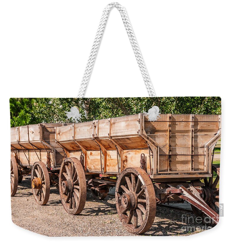 Big Horn County Weekender Tote Bag featuring the photograph Close-up of Grain Wagons by Sue Smith