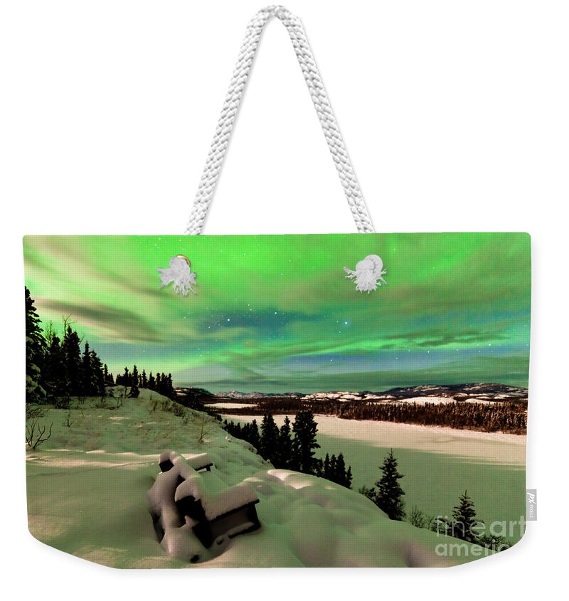 Alaska Weekender Tote Bag featuring the photograph Clouds and Northern Lights over Lake Laberge Yukon by Stephan Pietzko
