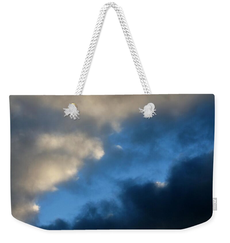 Clouds Weekender Tote Bag featuring the photograph Clouds Converging by Michael Saunders