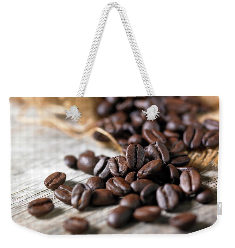 Greece Weekender Tote Bag featuring the photograph Coffee Beans On Wooden Surface by Maria Toutoudaki