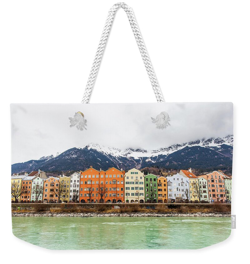 Tranquility Weekender Tote Bag featuring the photograph Colorful Buildings Along The Inn River by Merten Snijders