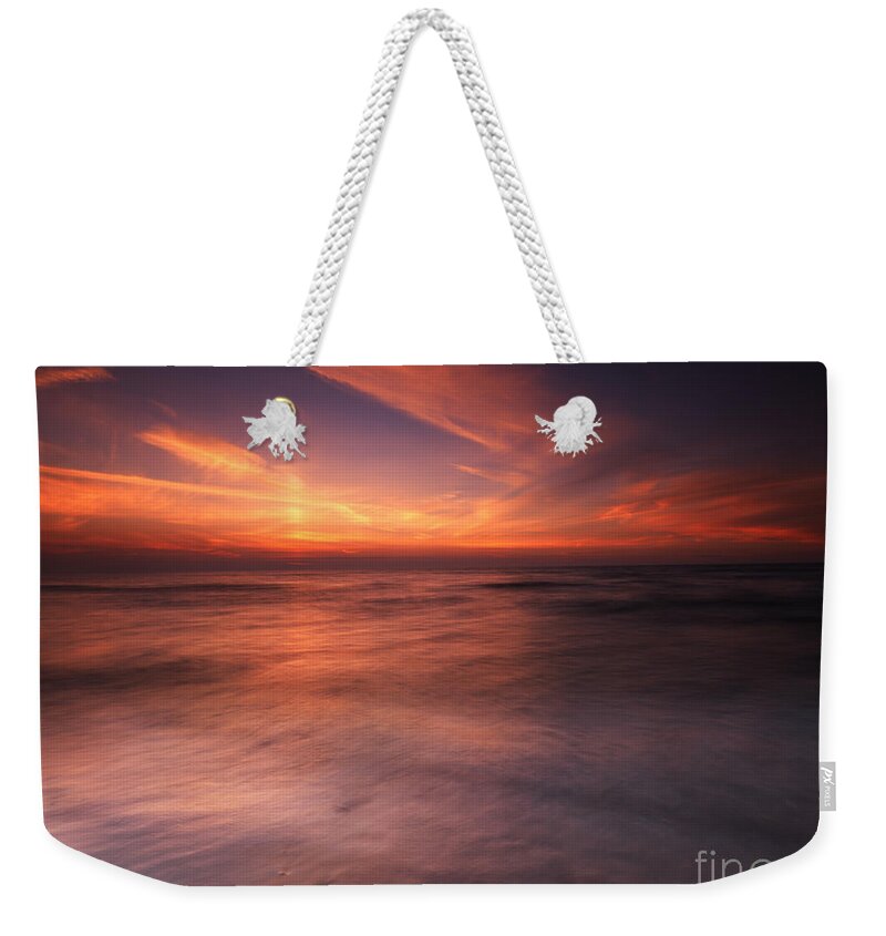 Sunset Weekender Tote Bag featuring the photograph Colorful sunset over water of lake Huron by Maxim Images Exquisite Prints