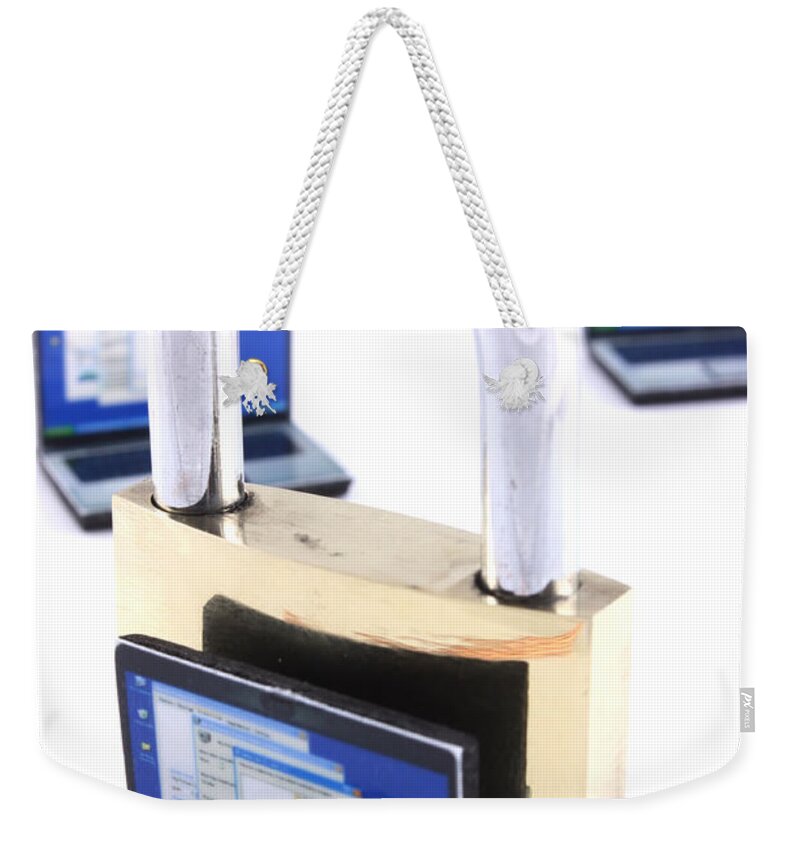 Unlocked Weekender Tote Bag featuring the photograph Computer security concept by Simon Bratt