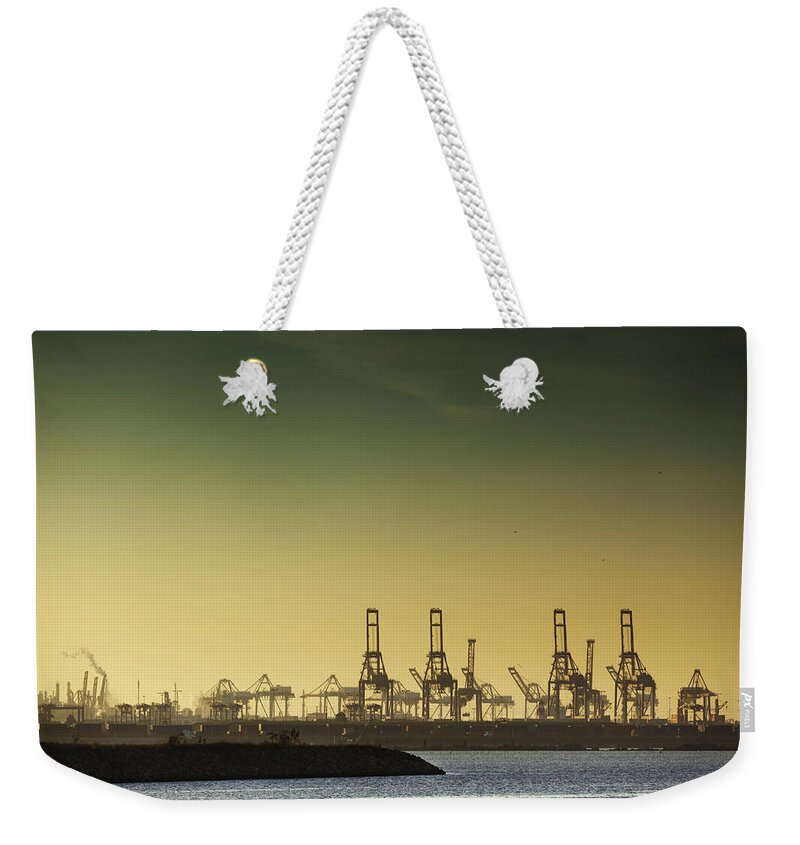 Freight Transportation Weekender Tote Bag featuring the photograph Container Cranes At Port Of Los Angeles by Halbergman