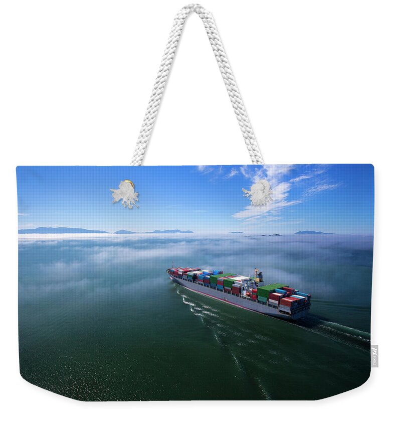 Freight Transportation Weekender Tote Bag featuring the photograph Container Ship by Dan prat