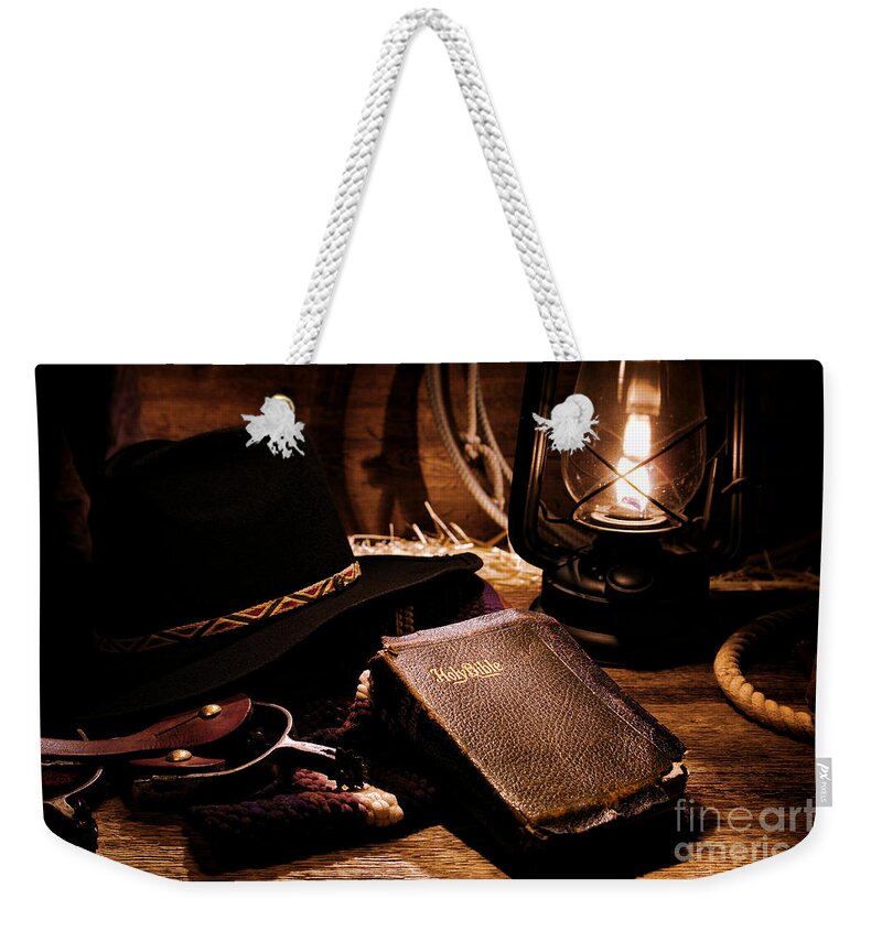 Western Weekender Tote Bag featuring the photograph Cowboy Bible by Olivier Le Queinec