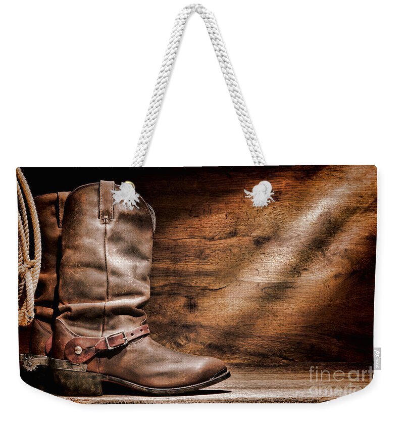 Cowboy Boots Weekender Tote Bag featuring the photograph Cowboy Boots on Wood Floor by Olivier Le Queinec