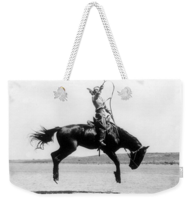 Occupation Weekender Tote Bag featuring the photograph Cowgirl Riding Bucking Bronco, 1919 by Science Source
