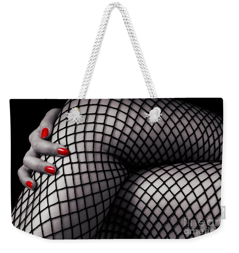 Legs Weekender Tote Bag featuring the photograph Crossed sexy woman legs in fishnet stockings by Maxim Images Exquisite Prints