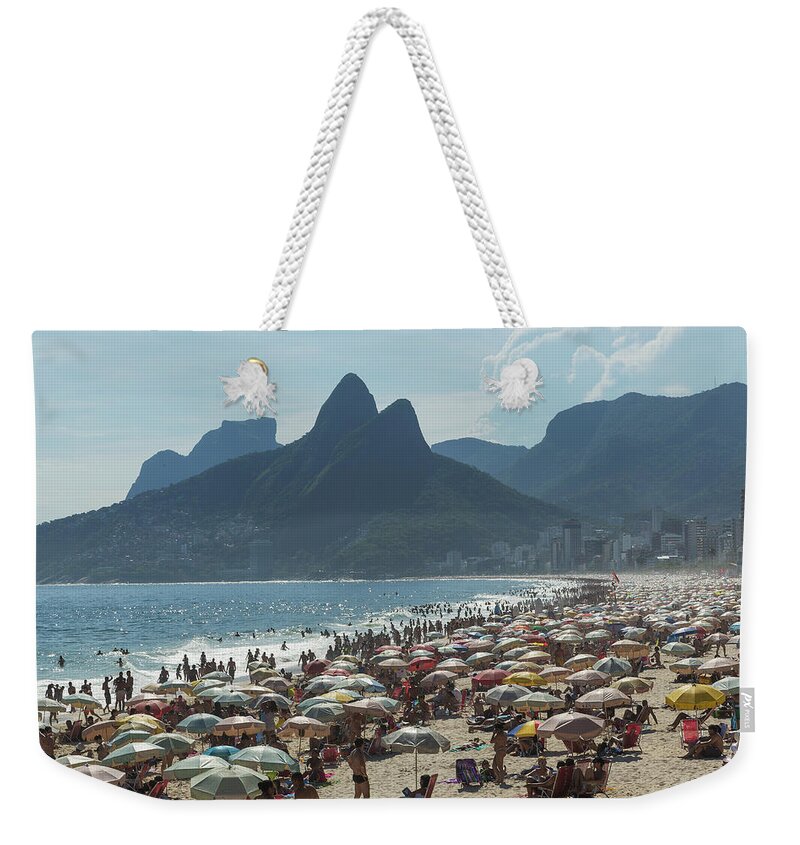 Water's Edge Weekender Tote Bag featuring the photograph Crowded Beach by Buena Vista Images